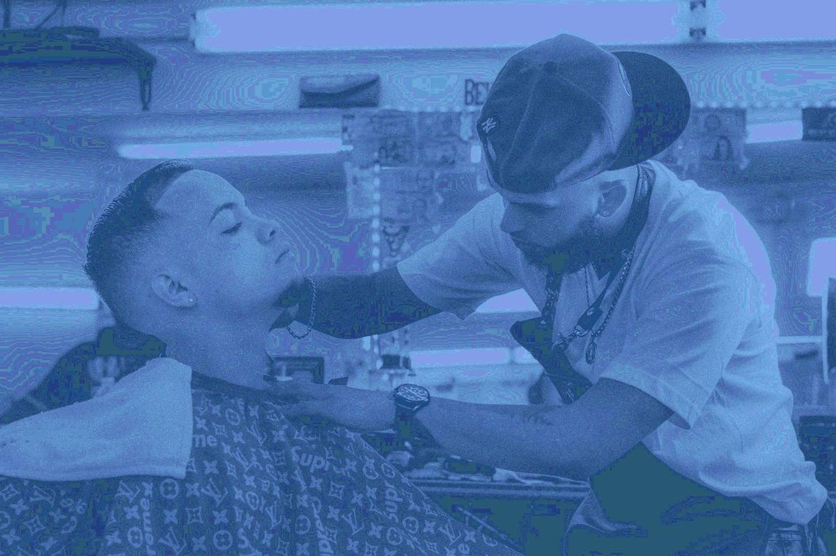 Barber finishing a client with a straight razor neck shave